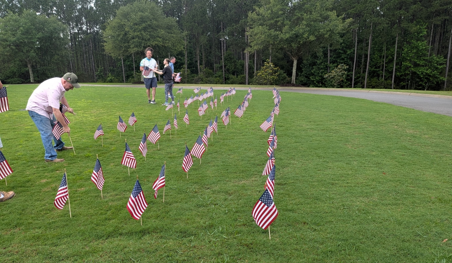Placing Flags at the State Veterans Cemetary in Spanish Fort, AL